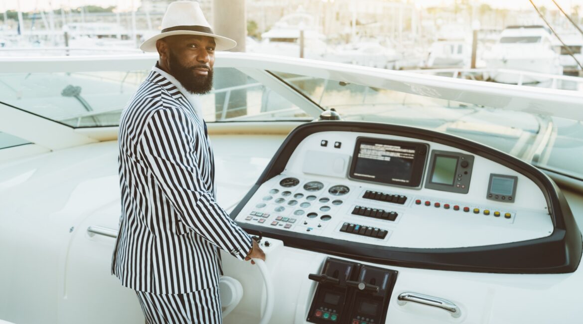 A black man on his luxury his yacht